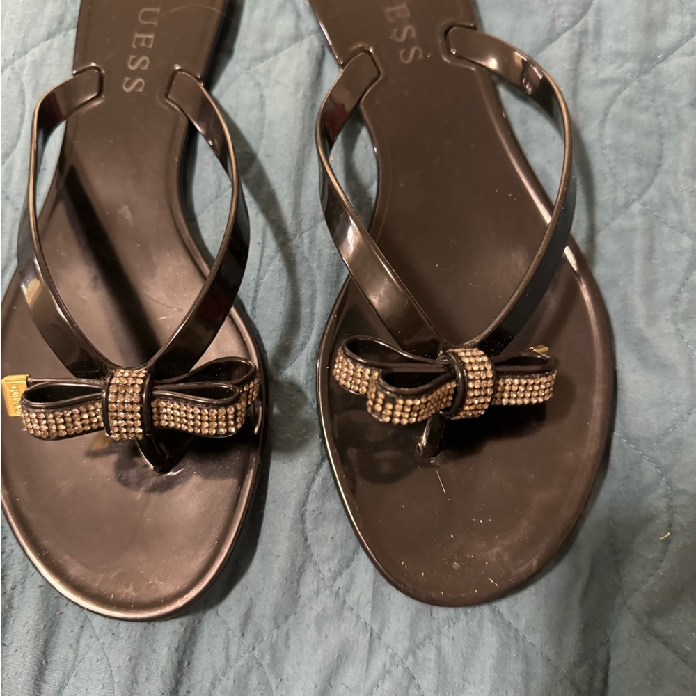 Wore one time  Guess Black flip flops